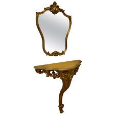 Dazzling in its bright gold leafed finish and clear glass, the. 19th Century French Gilt Console Or Hall Table And Matching Mirror Set For Sale At 1stdibs