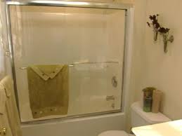 Here, a transparent glass partial wall exposes the beauty of the tile job at all times. Install Glass Shower Doors Hgtv