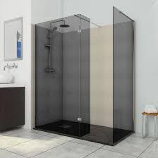 Smoked glass is glass held in the smoke of a candle flame (or other inefficiently burning hydrocarbon) such that one surface of the sheet of glass is covered in a layer of smoke residue. Deluxe8 700mm Smoked Black 8mm Glass Wet Room Shower Screen Walk In Panel