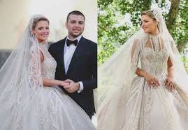 The designer, whose haute couture gowns are red carpet staples , just released a short movie called oui showcasing his ethereal wedding creations. Christina Mourad S Wedding Dress Details As She Weds Elie Saab Junior In Lavish Three Day Ceremony A E Magazine