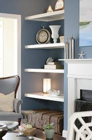 Add white to a room to make patterns and colors appear lighter. Top Model Home Living Room Shelves Blue Living Room Blue Grey Living Room