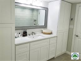 You can convert a kitchen cabinet to a vanity simply by trimming it down. White Bathroom Vanity Cabinets And Vanity Tops Granite Countertops Quartz Countertops Kitchen Cabinets Factory