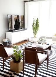 Black And White Mid Century Modern Rug Tour West Hollywood S Eclectic Mid Century Glamour Apartment Design District Eclectic Living Room Danish Modern Living Room Rugs In Living Room