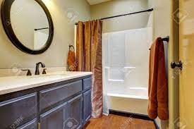 Check spelling or type a new query. Bathroom Interior With Dark Brown Bathroom Vanity Cabinet And White Bath Tub Stock Photo Picture And Royalty Free Image Image 30508375