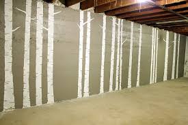 Concrete walls in a basement can be covered most commonly by drywall, which requires sealing, installing foam board sheets, assembling a wooden frame, and gluing the drywall in place. So We Have This Big Empty Unfinished Basement There Is One Huge Wall Spanning 30 Feet Long It S Concrete Lightly White Washed Forest Mural Birch Tree Mural Cinder Block Walls