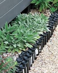 9 Creative Ideas For Diy Garden Borders Wine Bottle Garden Sustainable Garden Garden Edging