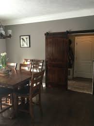 Rustic Dining Design Sliding Barn Door To The Mud Room Wall Color Sw Dovetail Dining Room Wall Color Room Wall Colors Rustic Dining Room