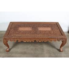Available in natural wood finished or antiquely decorated with tiny colored glasses and hand painted to fit your style. 20th Century Anglo Indian Hand Carved Coffee Table Chairish