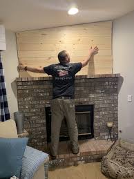 A framed hearth with a real stone top was also built at the. Shiplap Accent Wall Above The Fireplace Coastal Design Shiplap Shiplap Accent Wall Installing Shiplap
