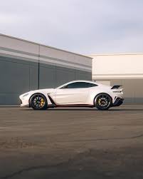 Image result for Sunburst Yellow 2012 Aston Martin