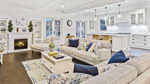 Covered patio and decks overlooking landscaped grounds. Hamptons Style Beach House Inspired By Magazine Realestate Com Au