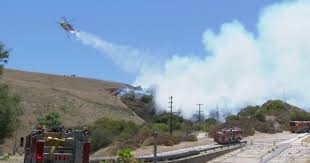 Evacuation warnings issued as brush fire burns near Encino Reservoir