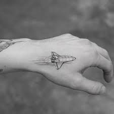 Black And White Space Tattoo Single Needle Space Shuttle Tattoo On The Left Hand Small Hand Tattoos Planet Tattoos Space Tattoo