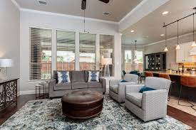 Sherwin Williams Agreeable Gray Walls And Alabaster Trim Charcoal Couch Blue Geometric Chairs And Blue Rug By Basse Interior Design Furniture Charcoal Couch