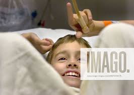 Oct 21, 2005; Sacramento, CA, U.S.; DEREK MADSEN, 10, smiles as he waits in  pre-op