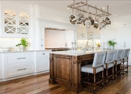 The Hardwood Floors Together With The Stained Island Creates A Warm Contrast Against The White C Stained Kitchen Cabinets Interior Design Kitchen Home Kitchens