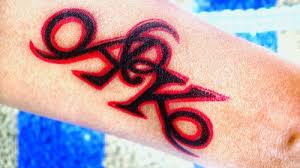 Wavy s design across the arm: Your Ak Alphabet Tattoo Designs Selection