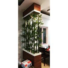 Bamboo feature acts as a partition between the bedroom and bath [design: Mayon Interiors And Constructions Posts Facebook