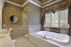 See more ideas about bathroom design, bathroom inspiration, bathrooms remodel. Bathroom Uses Cream Colored Ceramic Tiles With Ceramic Tile Borders In Wave Patterns And Has An Oversized Jet Tub Interior Design Inspirations