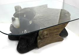 Black forrest bronze bear coffee table realistically cast and modeled of a bear on his back supporting the oval glass top with his four legs. Big Sky Carvers Bud Bear Coffee Table Idaho Auction Barn