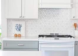 Tiled kitchen backsplashes give a custom look to a home and stand up better than a wallpapered backsplash according to an angie's list magazine a backsplash is part of the finished, custom look buyers want, williams says. White Hexagon Tile Kitchen Backsplash Novocom Top