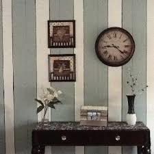 Clad an unused chimney breast by building out a frame, and covering the style of panelling in this study is the easiest to achieve. One Idea To Change Wood Paneling Creating Vertical Stripes And Pinstriping The Narrow Grooves With Black Paint G Painted Paneling Kid Room Style Wood Paneling