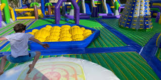 Tuff Nutterz Mobile Inflatable Park Is Visiting Tuggerah Playing In Puddles