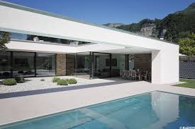 Einfamilienhaus Pool Flachdach Steinfassade Panoramafenster Dachterrasse Fliesenboden Parkett Innenhof Architektur Haus Haus Architektur Fassade Haus