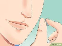It is placed right above the curve of the nose upwards from the lip area. 4 Ways To Take Your Nose Stud In And Out Of Your Nose Wikihow Life
