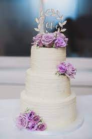 Buttercream Wedding Cake With Fresh Flowers Purple Violet Ruffles Cream Wedding Cakes Purple Wedding Cakes Simple Wedding Cake