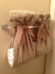 A towel bar that's topped by a triangle that's great for storage but also looks amazing. Bathroom Towel Decor Ideas Wild Country Fine Arts