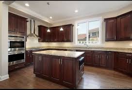 Kitchen With Cherry Wood Cabinets Cherry Wood Floors And Light Granite Counter Tops Cherry Cabinets Kitchen Dark Wood Kitchens Kitchen Cabinets And Flooring