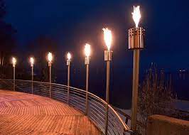 Tiki Torches Up High On Fence To Ward Off The Bats Outdoor Fire Pit Outdoor Lamp Fire Torch