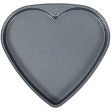 These are wilton cake pans and are in very nice condition, the only thing that i can find is a scratch on one of them. Wilton Treats Made Simple Heart Shaped Non Stick Cookie Pan Walmart Com Walmart Com