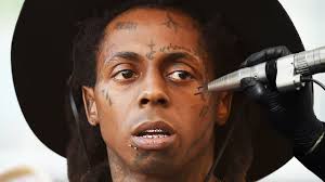 The mixed imagery of his chosen body art. Removing Lil Wayne S Face Tattoos Youtube