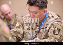 259th Expeditionary Military Intelligence Brigade Commander, Col. Rose  Keravuori, speaks to Soldiers from the 201st EMIB, and the U.S. Army  Reserve's 259th EMIB, who gathered at French Theater,