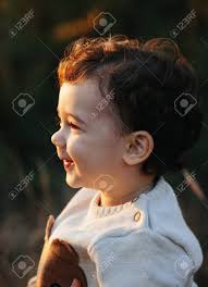 Close Portrait Of A Sweet Smiling Toddler Baby Boy In Autumn Park On Sunset Curly Hair Boy Stock Photo Picture And Royalty Free Image Image 134044966