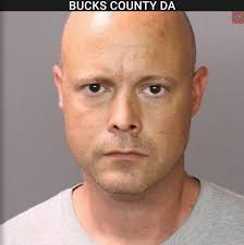MAN CHARGED WITH RAPE OF FOSTER CHILD, TEEN BOY A Tullytown man has been  charged with sexually abusing two teen boys, including a foster child in  his care. John Michael Evans, 40,