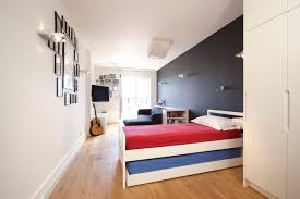 Be inspired by this space and add an exposed brick wall to add to the industrial vibe and if pulling off plaster isn't an option for you, there are loads of really realistic brick print wallpaper that can create a really similar. Eye Catching Wall Decor Ideas For Teen Boy Bedrooms