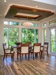 There is one feature of a room that is just as important as the flooring choices: Dining Room Ceiling Ideas Wood And Lights Ceiling Design Living Room Dining Room Ceiling Ceiling Design