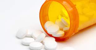 White and green pill capsule with drop of cbd oil and green leafs of cannabis on white. 319 Pill Side Effects And Reaction Findatopdoc