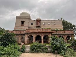 Photograph of the ghats and temples on the River Sipra at Ujjain, taken by George Edward Herne in 1869.