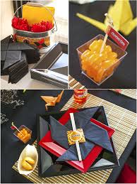The stems of the wine glasses are in a deep blue. A Japanese Origami Dojo Ninja Birthday Party Party Ideas Party Printables Blog