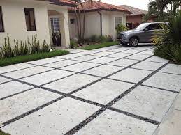 Use 2x6 lumber to make the forms that the concrete will be poured into. Modern Rectangle Concrete Driveways Diy Concrete Driveway Modern Driveway Driveway Design