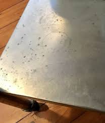 repair a pitted stainless steel table