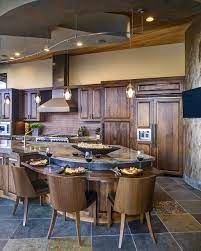 Dark wood kitchen islands are a great way to add a useful surface and storage medium if you have the space and need within your kitchen, and will compliment the dark wood of your cabinetry. 22 Charming Wood Kitchens Kitchens With Wood Finishes