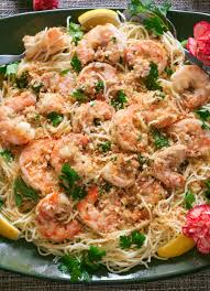 Creamy polenta and lemon rice pilaf would be fantastic as well, and of course a glass if white wine such as pinot grigio and crusty garlic bread to sop of the garlic butter sauce. Easy Shrimp Scampi A Classic Italian American Recipe Over Pasta