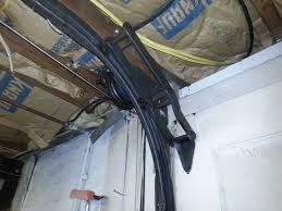 The torsion springs are mounted opposite to the way they are on standard doors, and the springs are wound down instead of up. 21 Awesome Low Headroom Garage Door Hinges