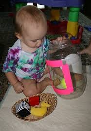 Chasing Cheerios Putting Objects In A Large Container Young Toddler Activities Infant Activities Toddler Activities