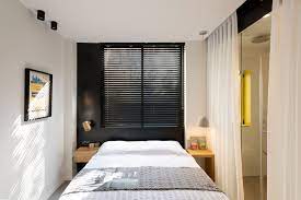 In addition to a sloped ceiling in the front, the home includes a kitchen and a living room with a central fireplace, two bedrooms and a bathroom. 600 Square Foot Apartment Uses Glass Walls To Create Two Bedrooms Idesignarch Interior Design Architecture Interior Decorating Emagazine
